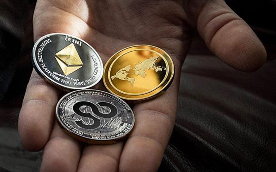 An example of AirGo Miles’ cryptocurrency (below the two other coins) is shown in a company handout. (AirGo photo)