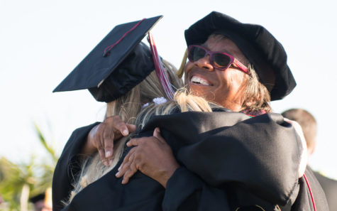 Palomar College President Joi Lin Blake hugs a graduate during commencement ceremonies May 24 at the San Marcos campus. (Palomar College photo)