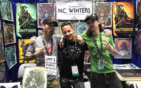 Carlsbad artist N.C. Winters (center) stands with assistants Seth Stewart (left) and Daniel Stewart (right) at Winters’ booth at the 50th annual San Diego Comic-Con, which ran July 18-21 in downtown San Diego. (Photo by Meghan Lanigan)