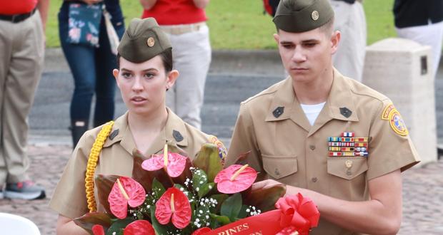 YM/SgtMaj Megan Lynch, National Young Marine of the Year, from Southeast County Young Marines in Seal Beach, CA; and YM/MGySgt Luke Smith from North San Diego Young Marines in Vista, CA; lay a wreath at the National Memorial Cemetery of the Pacific in memory of all the brave men and women who are interred there. (Photo courtesy: Young Marines)