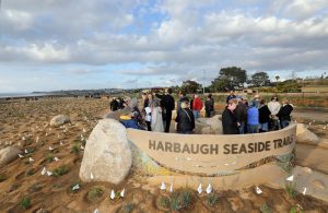 Visitors tour the Harbaugh Seaside Trails donor monument at sunset Feb. 22. The trails are located at the southwest end of San Elijo Lagoon in Solana Beach. (Nature Collective photo)