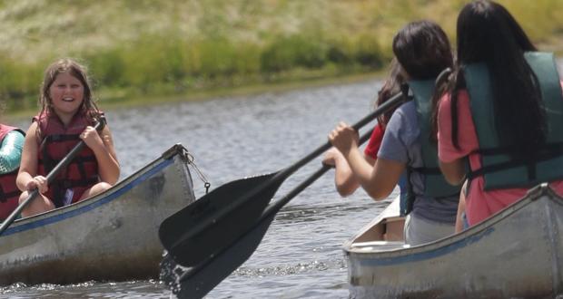 Katherine paddling a canoe at Camp Spero 
