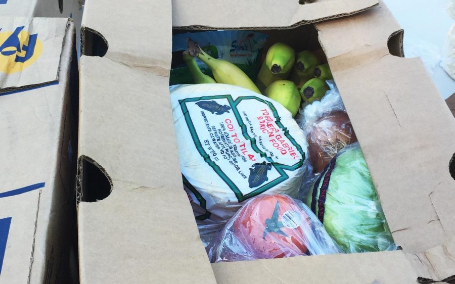 A box of food is prepared for a family in need on Wednesday, April 15, during an effort by La Colonia de Eden Gardens in Solana Beach. The boxes were handed out for families affected by the COVID-19 coronavirus crisis. (Courtesy photo)