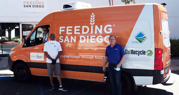 Darryl Harris, Operations Manager at Brother Benno Foundation, picks up a new food rescue van from Feeding San Diego CEO Vince Hall. (Photo courtesy: Feeding San Diego)