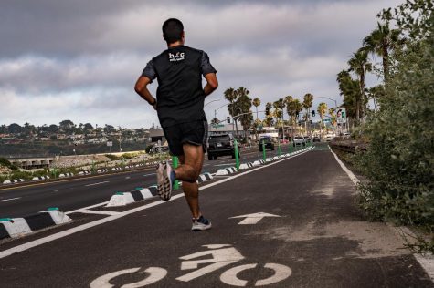 A jogger runs on a new lane dedicated for cyclists through Cardiff in Encinitas, pictured looking south on Wednesday, June 10. (Photo by Jen Acosta)