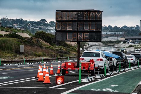 An Encinitas city sign, pictured Wednesday, June 10, reminds drivers and cyclists that bikes may enter the roadway along Coast Highway 101 in Cardiff. (Photo by Jen Acosta)