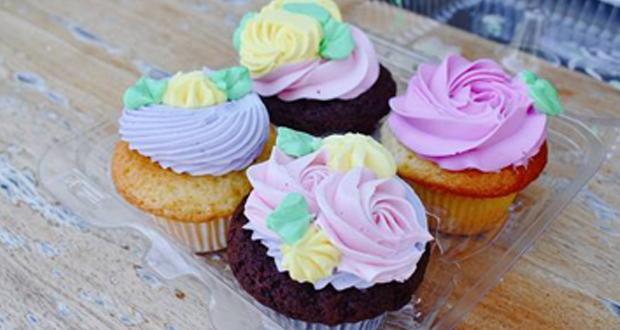 four multi colored cupcakes