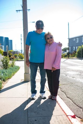 Cardiff residents Jay and Haruko Meinhardt stand at their Own a Piece of the Walk tile on Birmingham Drive on April 28. (Photo by Jen Acosta)