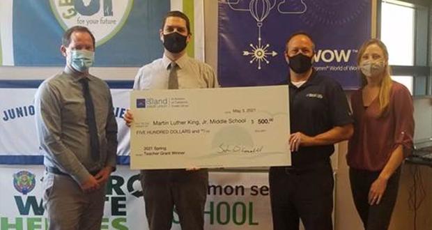 (Shown left to right) San Dieguito High School Academy Principal Adam Camacho and Teacher John Oly Norris receive a credit union grant from North Island Credit Union Encinitas VP/Branch Manager Lou Palestini. (Photo courtesy: North Island Credit Union)