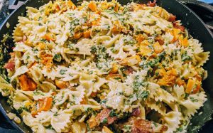 Butternut bacon pasta cooks in a skillet with spinach, onion, garlic, cream and Parmesan cheese. (Photo by Laura Woolfrey Macklem)