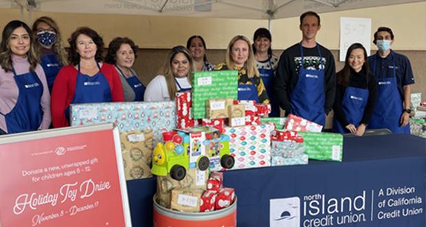 Volunteers assemble and wrap holiday gifts for Boys & Girls Clubs of Greater San Diego Club kids. The credit union donated toys collected during a branch drive as part of the Clubs’ Holiday Life Changers program. (Photo courtesy: North Island Credit Union)