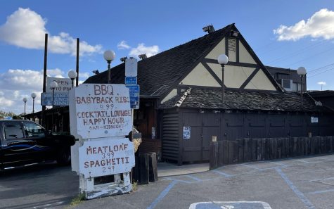 A roadside sign advertises $2.99 spaghetti at Cap’n Keno’s restaurant in the Encinitas community of Leucadia, pictured Feb. 23. The building’s rooftop sign is down for refurbishment. (North Coast Current photo)