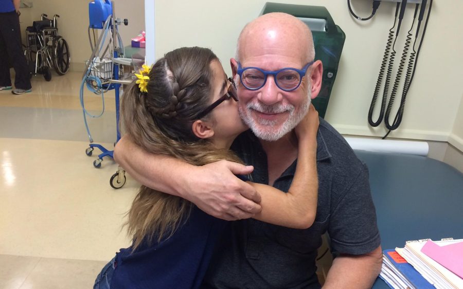 A young patient hugs Fresh Start volunteer Dr. Steven Cohen. (Fresh Start courtesy photo)