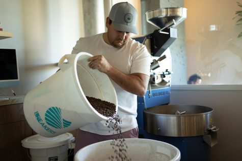 Cardiff resident Kyle Rosa mixes beans for Breakers Coffee + Wine in Carmel Valley on Feb. 17. Later this year, Rosa plans to harvest his own beans from his farm in San Marcos. (Photo by Jen Acosta)