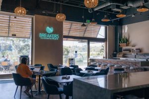 A Breakers Coffee + Wine customer works on their laptop Feb. 17 inside the coffee shop and wine bar, which opened last year in Carmel Valley. (Photo by Jen Acosta)