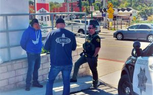 San Diego County sheriff’s deputies and California Department of Alcoholic Beverage Control officers issue citations in Encinitas on Saturday, March 12. (ABC photo)