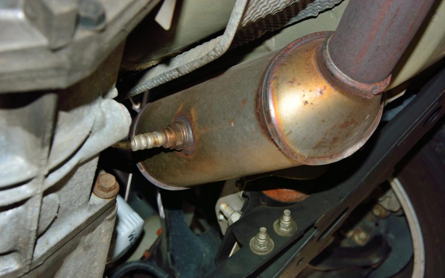 A stainless steel catalytic converter with an oxygen sensor or O2 sensor is shown installed on an exhaust system under a vehicle. Catalytic converters have become a target for theft in the past few years. (Photo by Tony Savino, iStock Getty Images)