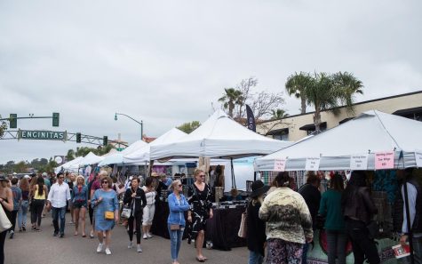 Visitors browse the vendors at the Encinitas Street Fair at the corner of D Street and South Coast Highway 101 on April 28, 2019. (NCC file photo by Cam Buker)