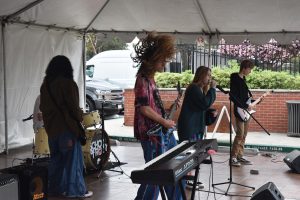 Students of the School of Rock house band perform on Sunday, April 10, at the Encinitas Spring Street Fair. (Photo by Charlene Pulsonetti)