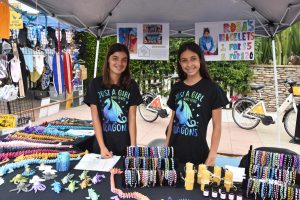 Sisters Tia and Talia, owners of TT3D and Rosa’s Bracelets, debuted 3D-printed animals and handmade bracelets, pictured April 10, during the Encinitas Spring Street Fair. (Photo by Charlene Pulsonetti)