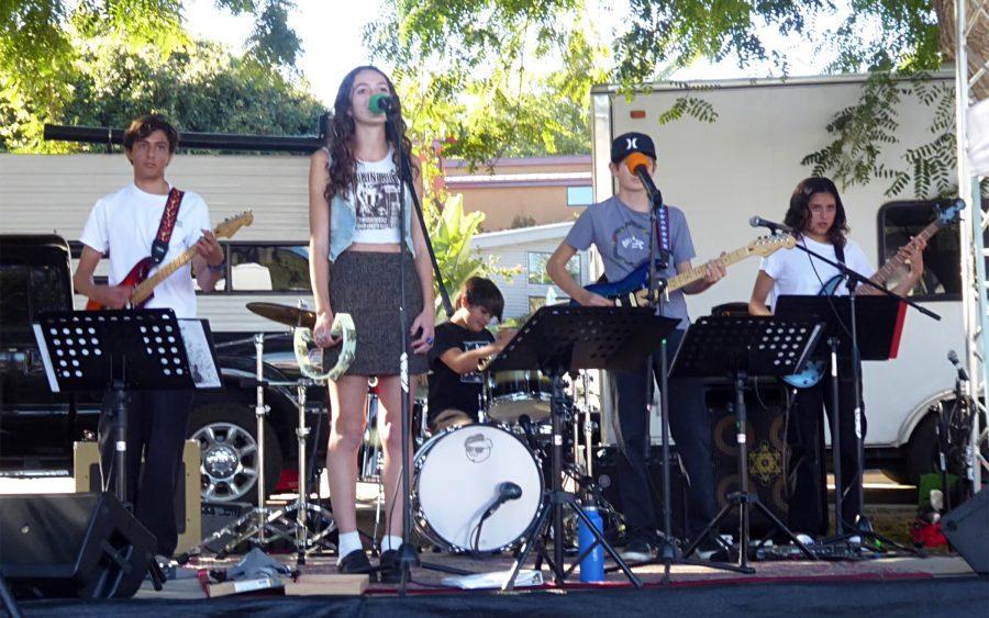 Encinitas School of Music students (left to right) Slater Todd, Ava Lorch, Charlie Southernland, Forest Southernland and Sofia Todd perform at Support Small Business Day at Leucadia Roadside Park on Nov. 27, 2021. (Photo courtesy of Stephen Rollins)