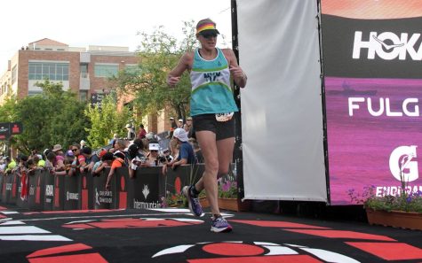 Encinitas resident Julie Dunkle crosses the Ironman finish line in Utah on May 7. (FinisherPix)