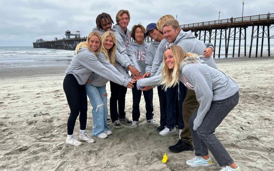 Team USA juniors and head coach Ryan Simmons gather sand from Oceanside Pier Beach on Monday, May 23, for the upcoming opening ceremonies at the ISA World Jr Surfing Championships in El Salvador. (Courtesy photo)