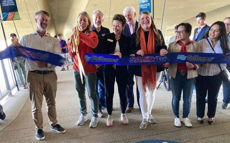 Encinitas Mayor Catherine Blakespear cuts the ribbon Saturday, June 4, for the opening of the new pedestrian suspension bridge at the San Elijo Lagoon Ecological Reserve. Among the officials pictured are Nature Collective Executive Director Doug Gibson (left of Blakespear) and state Assemblywoman Tasha Boerner Horvath, D-76th District (center, red scarf). (Encinitas city social media photo)