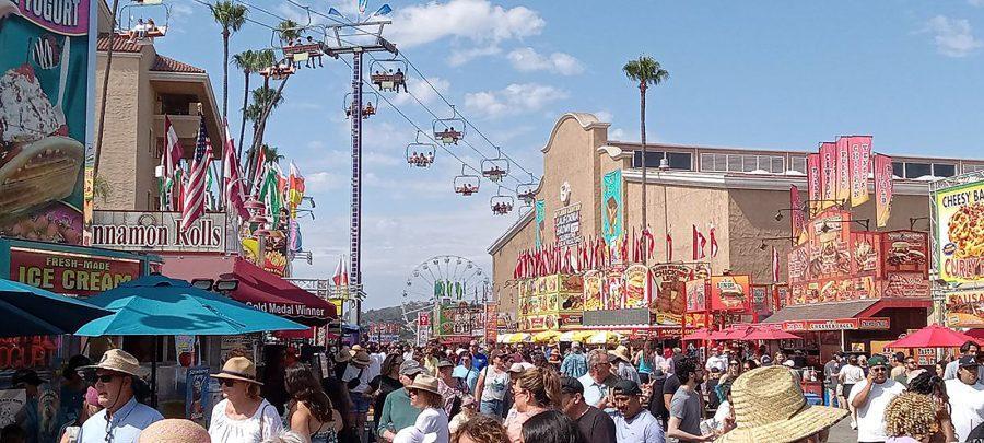 Visitors mingle at the San Diego County Fair in Del Mar on June 23. The fair is fully open this year after closures and scaled-back events during the COVID-19 pandemic. (Photo by Charlene Pulsonetti)