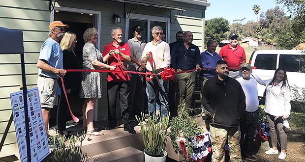 Representatives+from+groups+including+Warrior+Village+Project+and+Wounded+Warrior+Homes+stand+in+front+of+an+accessory+dwelling+unit+at+a+ribbon-cutting+ceremony+on+June+23%2C+2021.+%28Warrior+Village+Project+photo%29