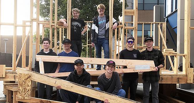 San Marcos High School students show the framework for a Warrior Village Project accessory dwelling unit on Nov. 30, 2019, before the pandemic. (Warrior Village Project photo)