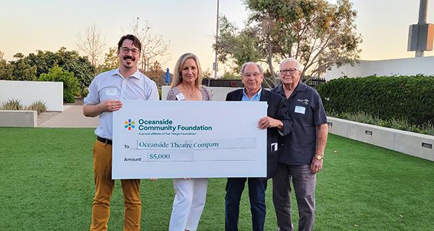 Left to right: Oceanside Theatre Co. representatives Alex Goodman, Leann Garms, John McCoy and Ed Parish accept a $5,000 grant from the Oceanside Community Foundation on Aug. 30. (Courtesy photo)