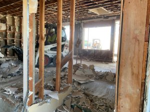 Demolition crews work inside one of the former Pacific View Elementary School buildings in Encinitas in early 2023. (Courtesy photo by Tony Kranz)