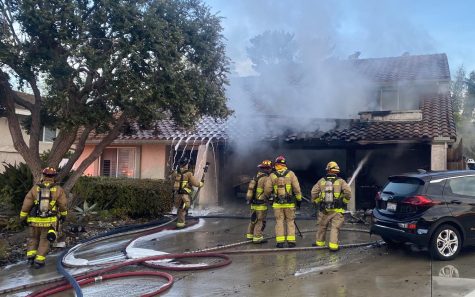 Carlsbad firefighters work to extinguish a house fire on Levante Street on March 7. According to city officials, the residents believed a lithium-ion battery might have been the cause. (Carlsbad city photo)