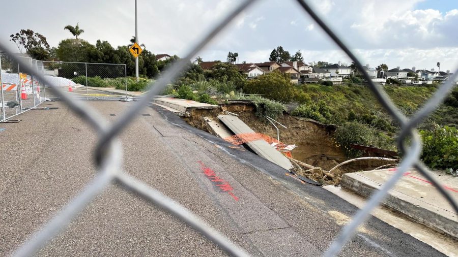 Barriers+surround+a+rain-worsened+sinkhole+March+1+on+Lake+Drive+in+the+Encinitas+community+of+Cardiff.+The+sinkhole+grew+again+on+March+10+and+11+as+rain+continued+to+move+through+San+Diego+County.+%28Photo+by+Roman+S.+Koenig%29