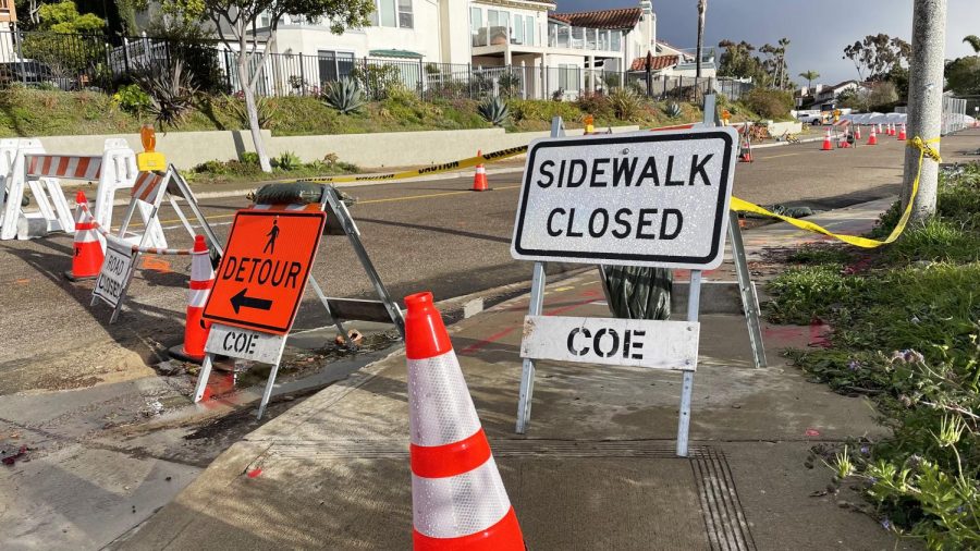 The city of Encinitas has posted signs and barriers at the site of a growing sinkhole on Lake Drive in Cardiff, pictured March 1. (Photo by Roman S. Koenig)