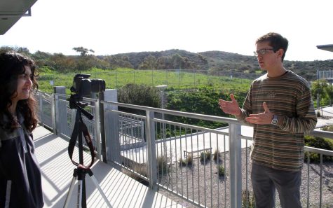 Nadia Razzaq (left) and Nick Cepek (right), students from Sage Creek High School in Carlsbad, capture a report for broadcast as part of the campus news program. (Photo courtesy of Rachel Grothe)