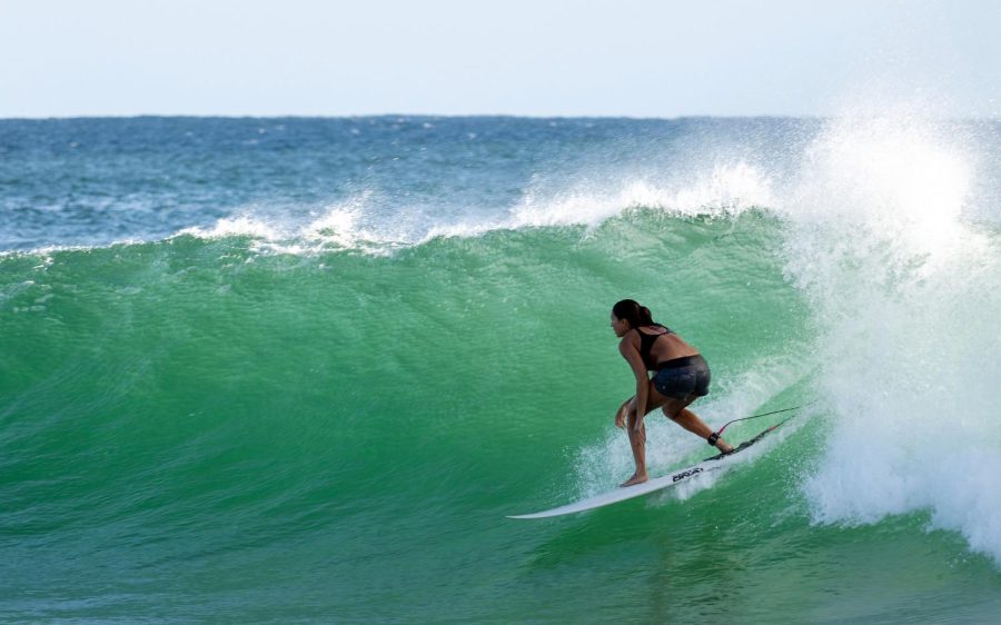 Surfing. (Photo by Barbara Rezende via Unsplash)