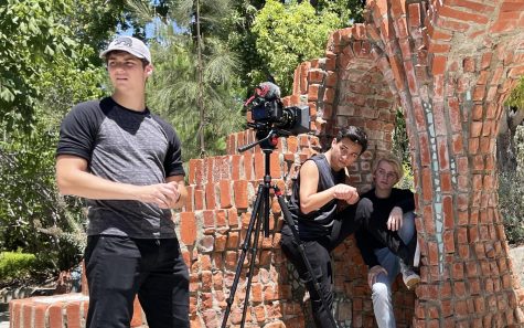 Palomar College student Garrett Glassell (left) stands ready to film a scene for the independent project “Red Blooded” on Aug. 5, 2022, which was filmed partly at the San Marcos campus. Pictured with Glassell are actors Kevin Quezada (center) and Cayden Dillingham. Glassells own Palomar project, a public service announcement, recently earned an Emmy nomination. (Photo by Jennie Olson Six, courtesy of Mercury Cinema)