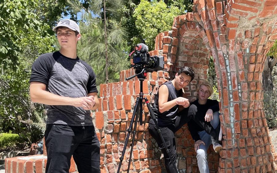 Palomar College student Garrett Glassell (left) stands ready to film a scene for the independent project “Red Blooded” on Aug. 5, 2022, which was filmed partly at the San Marcos campus. Pictured with Glassell are actors Kevin Quezada (center) and Cayden Dillingham. Glassell's own Palomar project, a public service announcement, recently earned an Emmy nomination. (Photo by Jennie Olson Six, courtesy of Mercury Cinema)