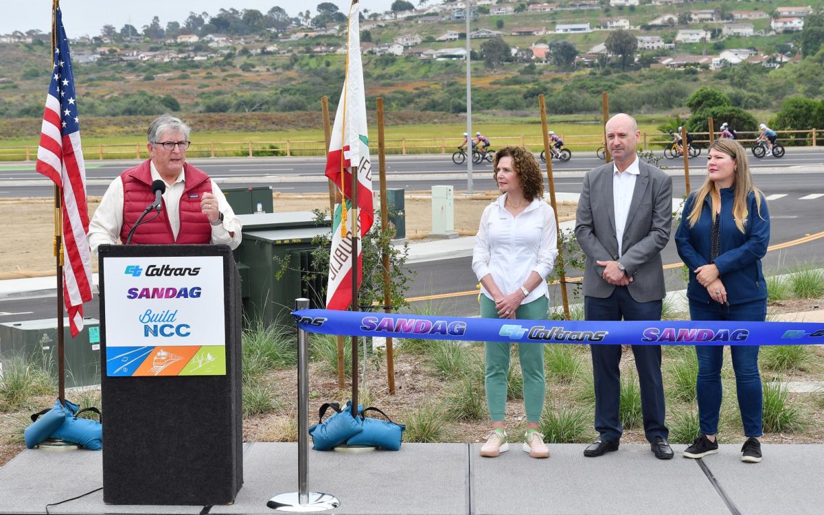 Encinitas Mayor Tony Kranz addresses visitors to the new San Elijo Activity Hub Park & Ride in Encinitas on Aug. 12. Next to him are (left to right) Solana Beach Mayor Lesa Heebner, Caltrans District 11 Director Gustavo Dallarda and Assemblywoman and former Encinitas City Council member Tasha Boerner (D-77th District). (Caltrans photo)