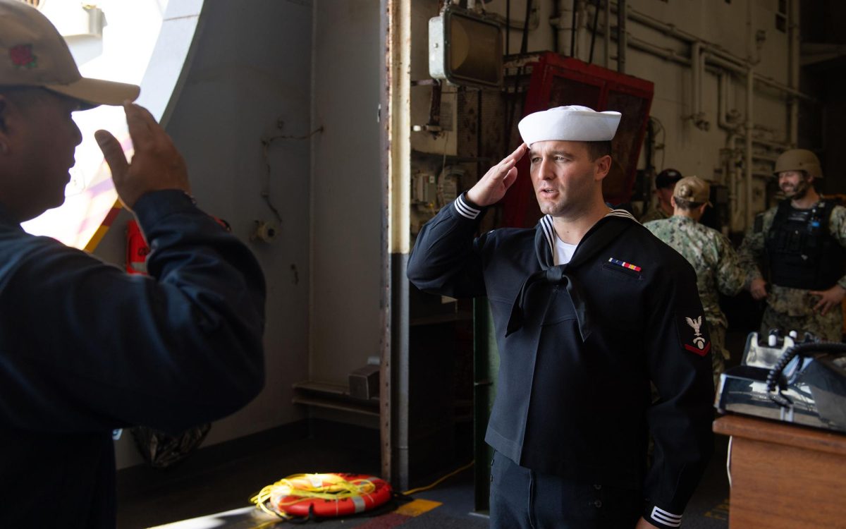 Petty Officer 3rd Class Henry Johnson (right) the son of Encinitas residents, serves aboard the self-contained mobile airport USS Theodore Roosevelt. (Navy Office of Community Outreach photo)