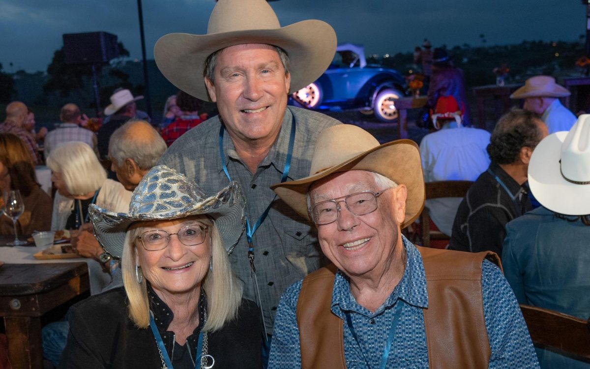 From left: Ella Helders, Paul Ecke III and Han Helders take part in a Barn Bash fundraiser at the Ecke Barn in Encinitas on Oct. 12. (Courtesy photo)