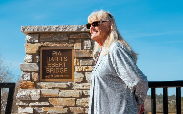 Former San Marcos Councilwoman Pia Harris-Ebert stands on the Via Vera Cruz bridge on Friday, Dec. 15. The span was named for Harris-Ebert, who was the city’s first woman City Council member and helped launch the agency that led to the San Marcos Creek Project. (San Marcos city photo)