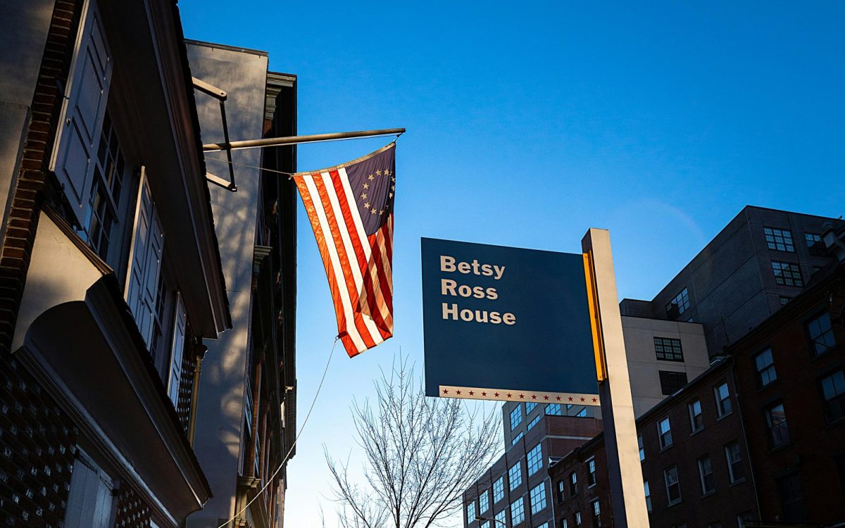The Betsy Ross Flag flies outside of the Betsy Ross House in Philadelphia. (Photo by Dan Mall via Unsplash)