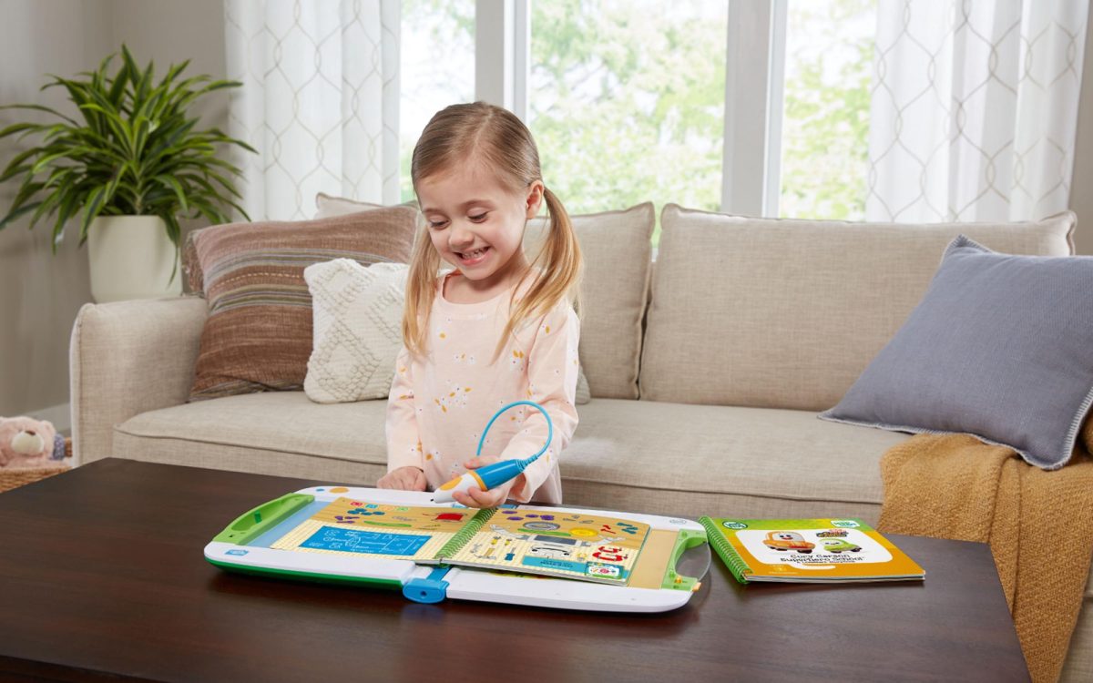 A girl plays with the LeapStart Learning Success Bundle. (LeapFrog photo)