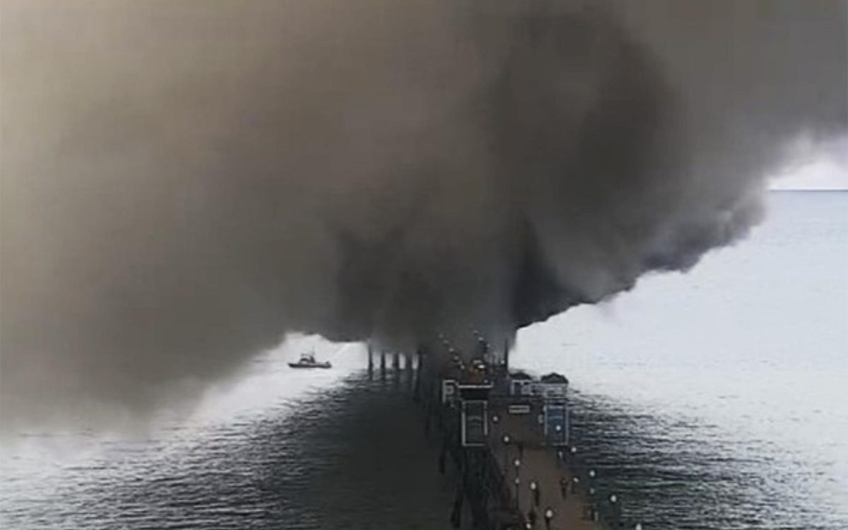 Crews work to stop a fire at the end of the Oceanside Pier on Thursday, April 25. (SurfOutlook photo via the city of Oceanside)