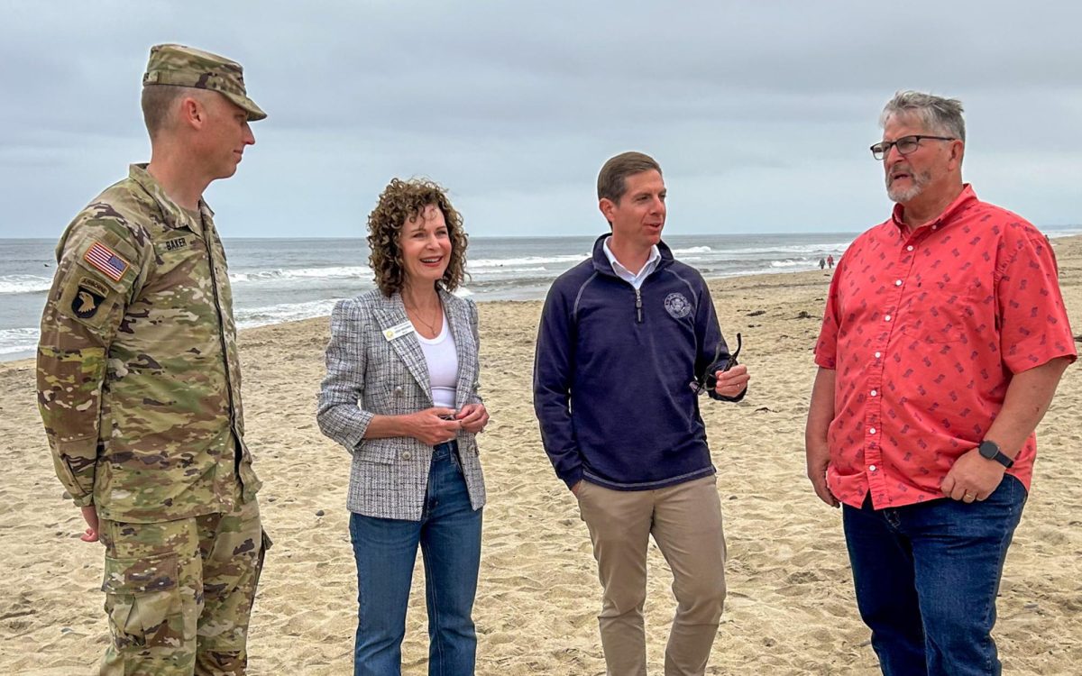 U.S. Army Corps of Engineers Col. Andrew Baker (far left), Solana Beach Mayor Lesa Heebner, U.S. Rep Mike Levin (D-49th District) and Encinitas Mayor Tony Kranz (far right) meet in Encinitas on May 13 to mark the completion a nearly $50 million sand replenishment project. (Courtesy photo)