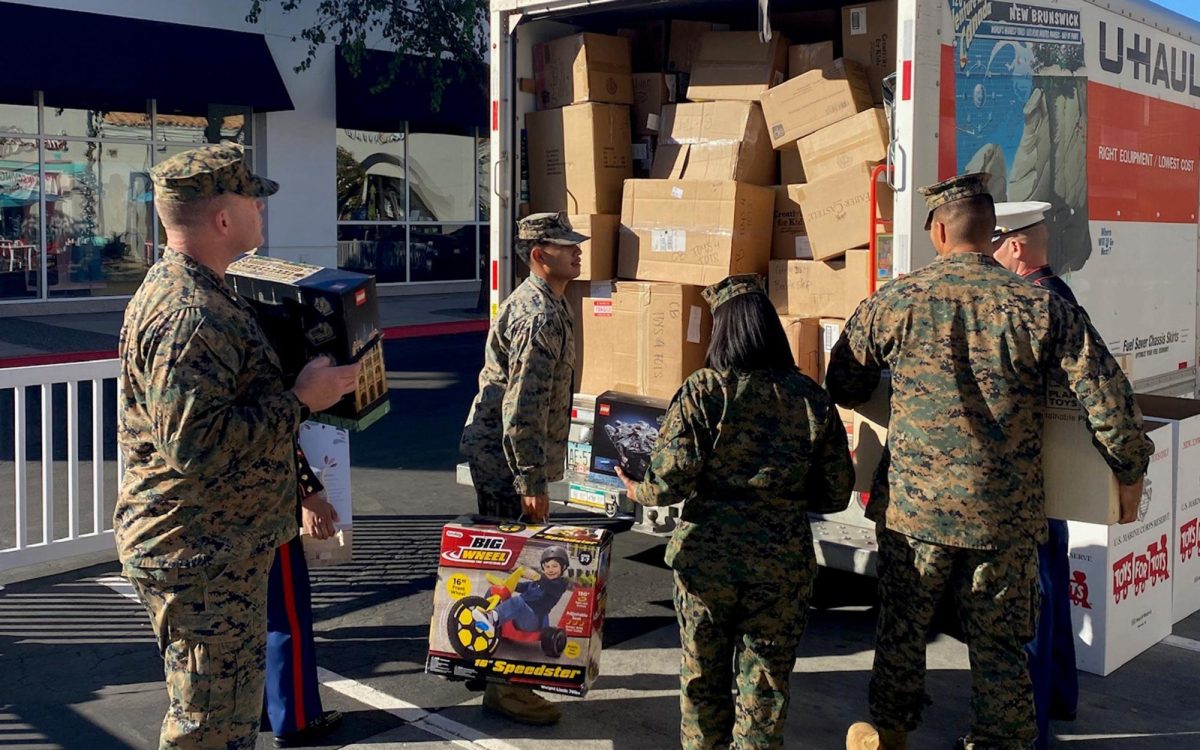 Marines load toys onto a truck in front of Geppetto’s in Carlsbad on Nov. 7, 2024, as part of an annnual anonymous $100,000 Toys for Tots donation. (NCC file courtesy photo)