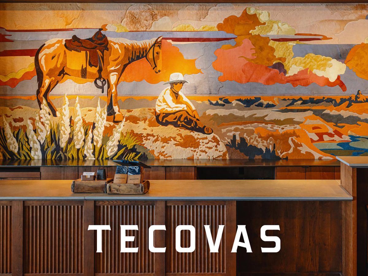 The cashier counter at Tecovas in Carlsbad, which opened Oct. 31, features a hide mural. (Courtesy photo)
